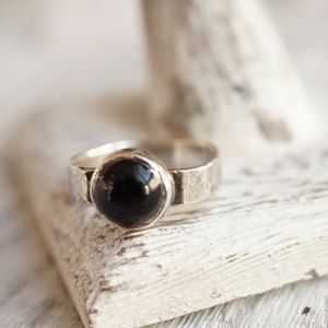 Black onyx ring with a shiny black cabochon